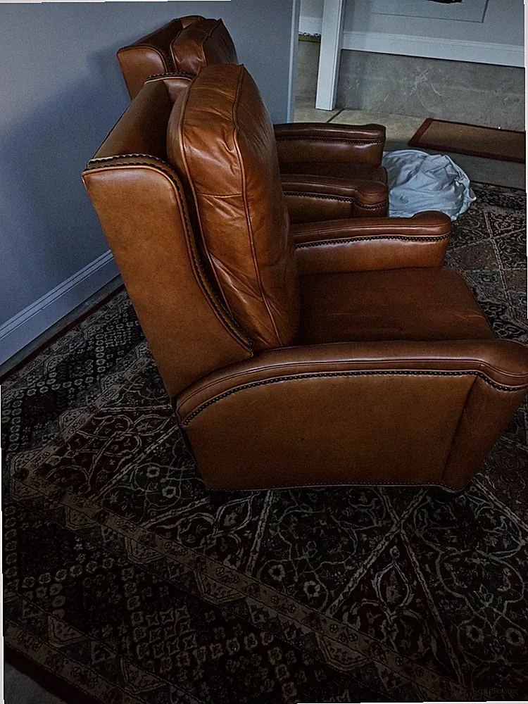2 Identical Leather Reclining Chairs $400