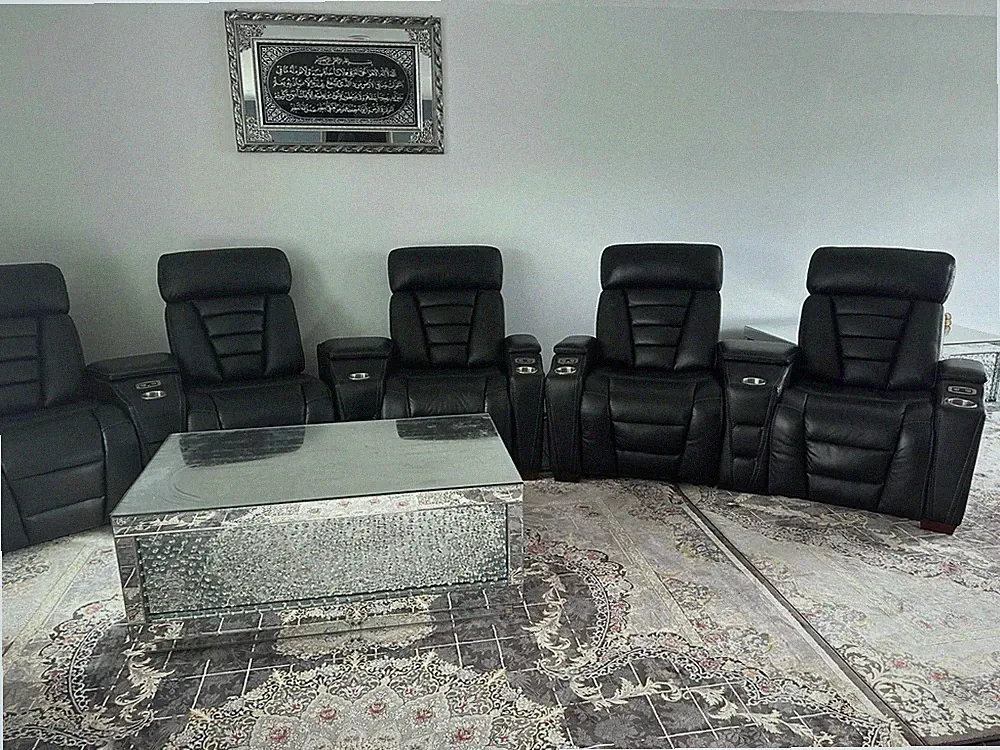 7 black leather recliners, used 6 months. Paid $5,300, selling for $3,500.